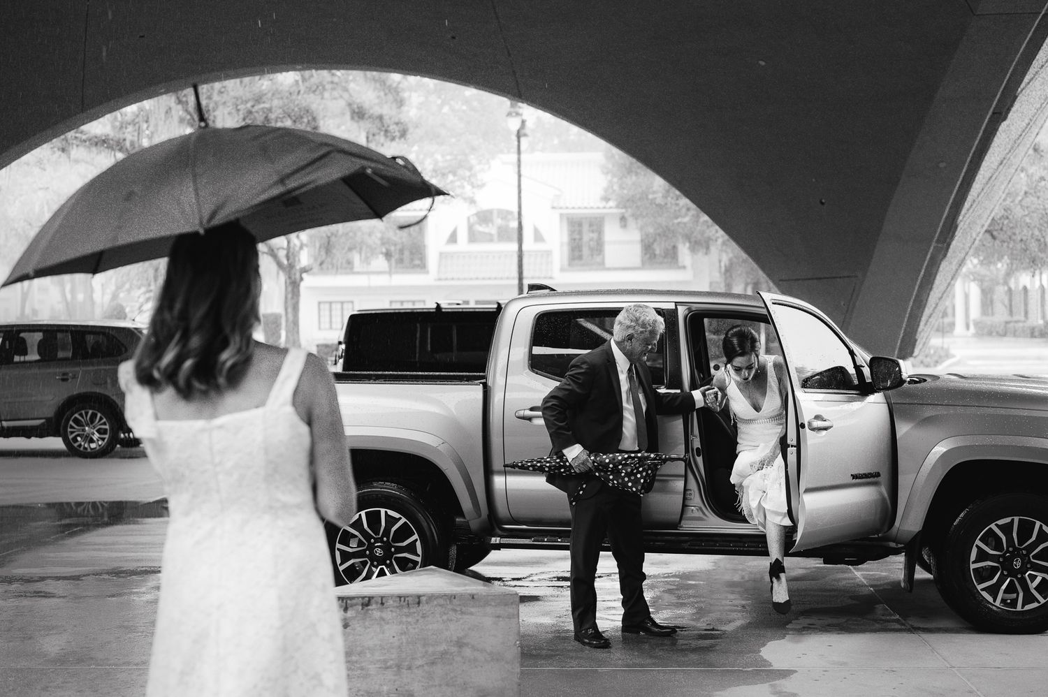 Black and white photos of wedding transportation and arrival moments.