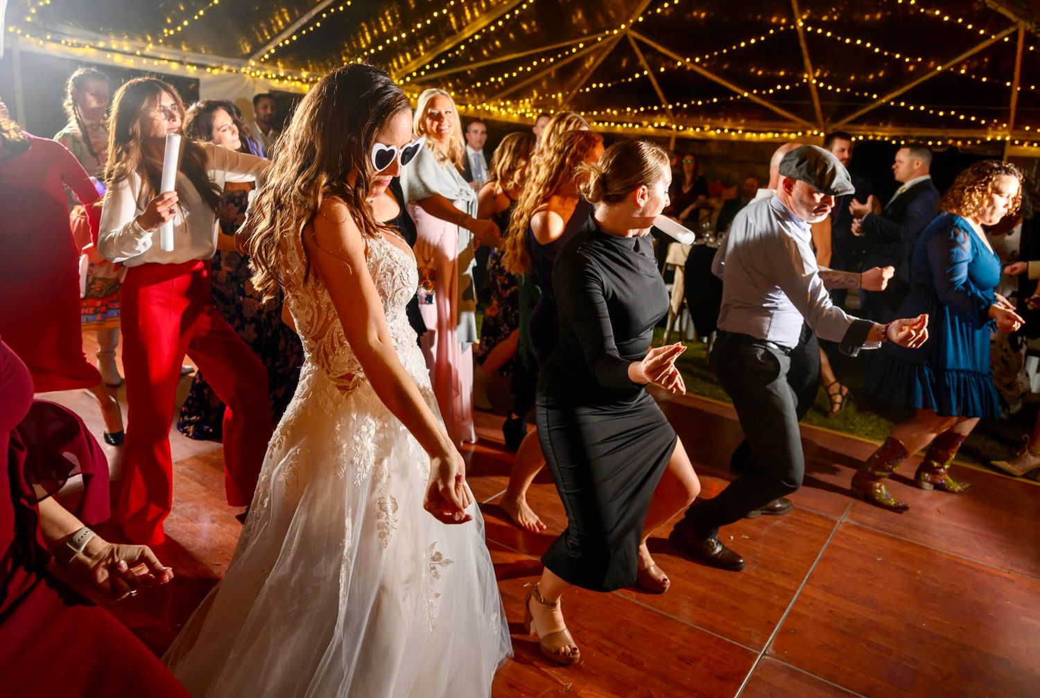 Fly dance fitness wedding of viral dance floor moment, bride, black dress, and gray hat guy