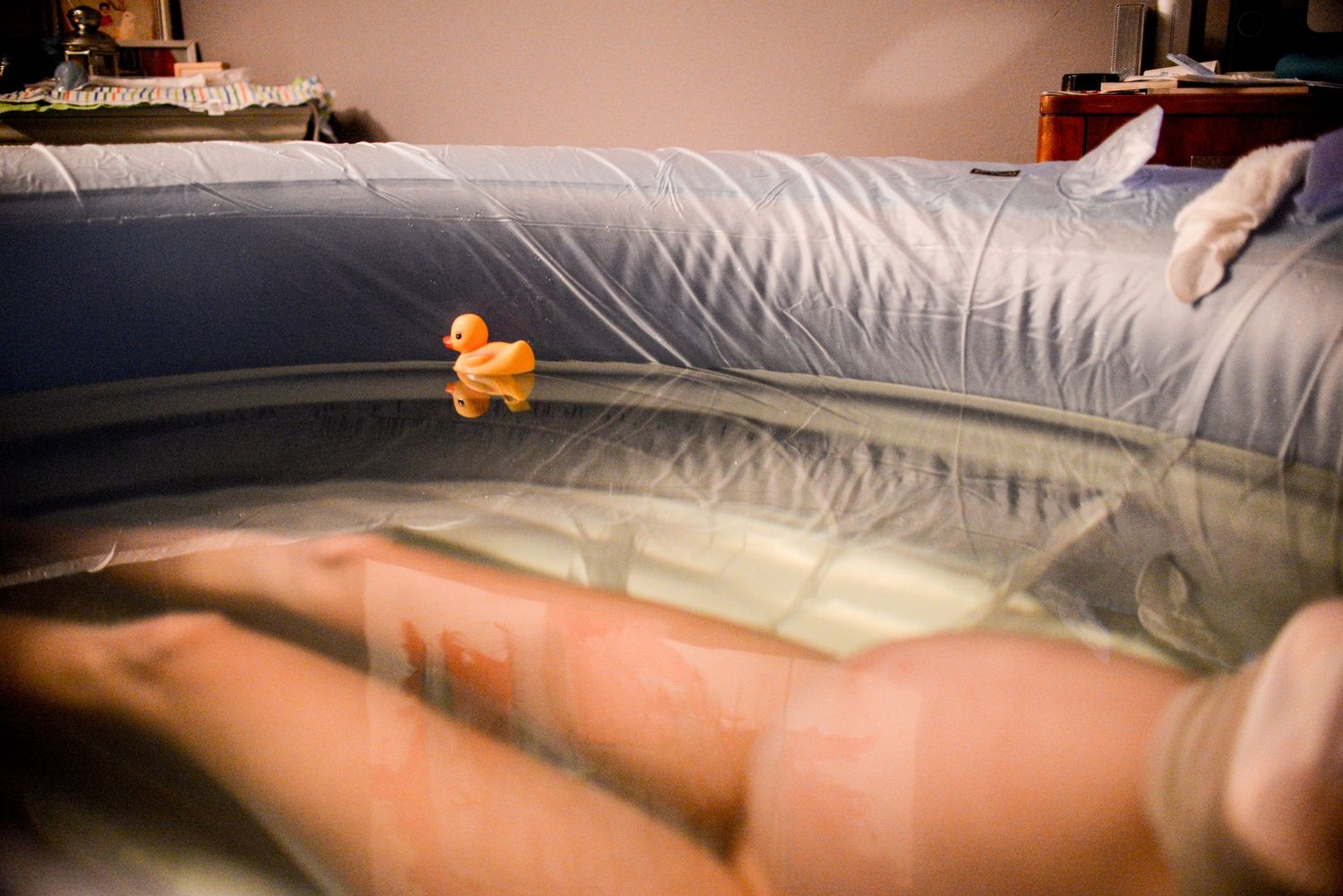 A sequence of images showing someone sleeping comfortably in bed with white bedding and a small orange butterfly decoration.