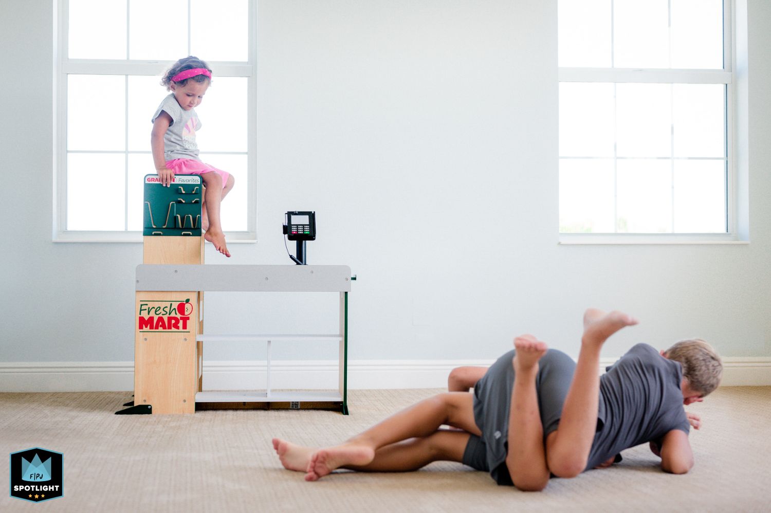 A sequence of yoga poses demonstrates a person transitioning from standing to lying down on a gray floor.