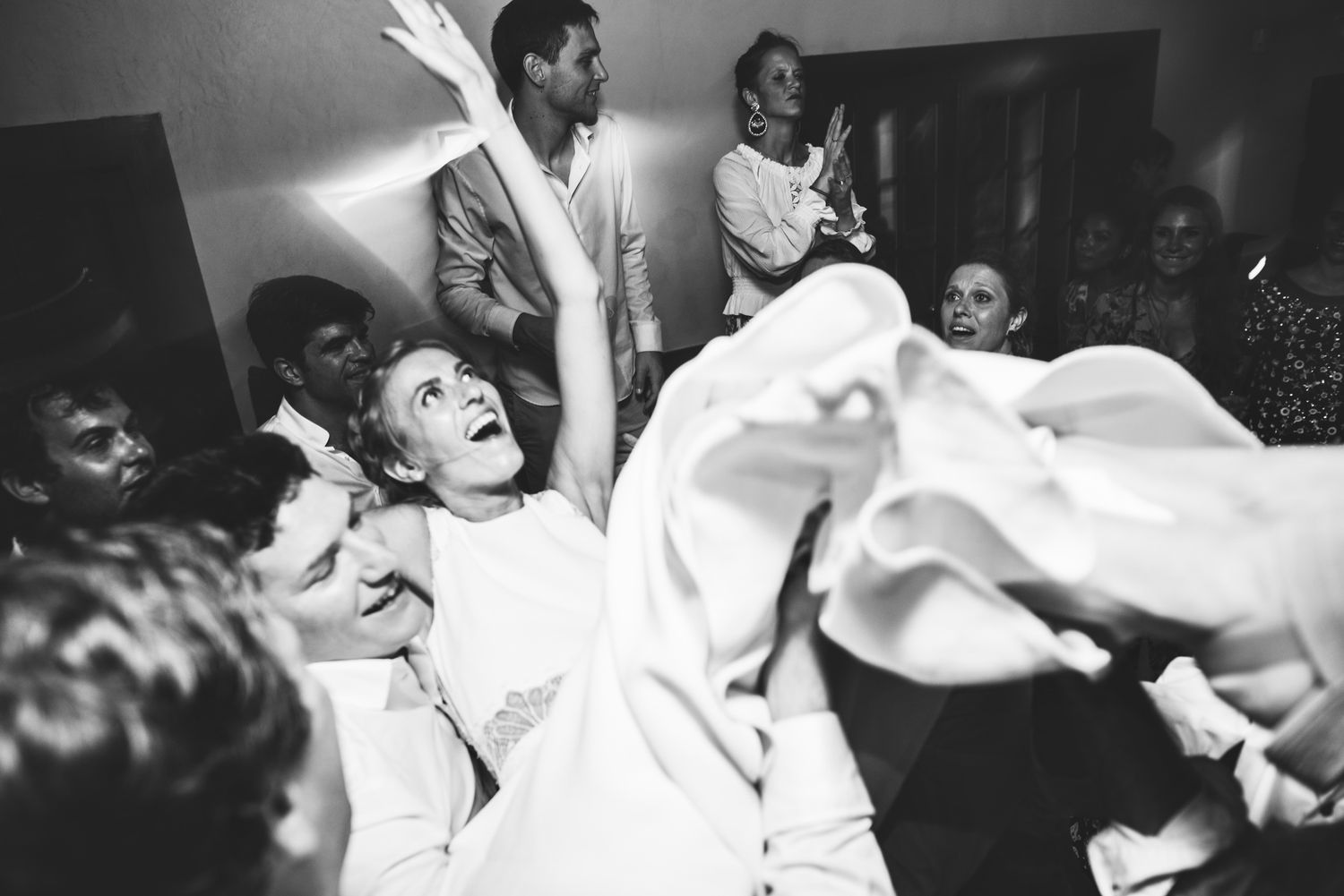 Black and white photos show people dancing energetically at what appears to be a lively party or celebration.