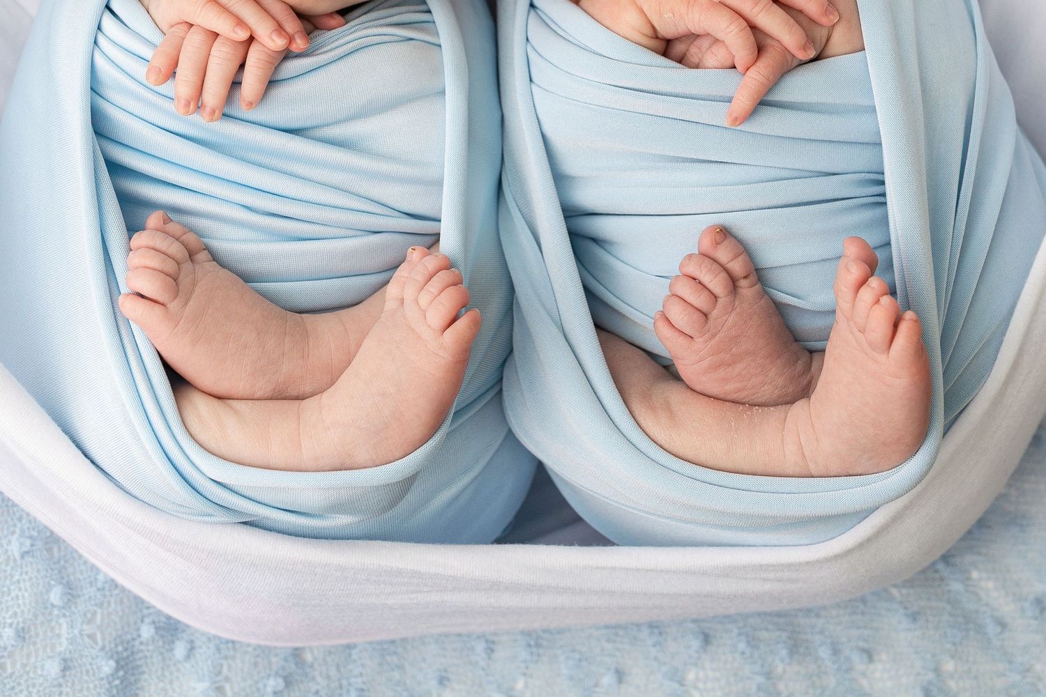 Step by step photos showing how to fold a cloth napkin into a pocket shape with light blue fabric.