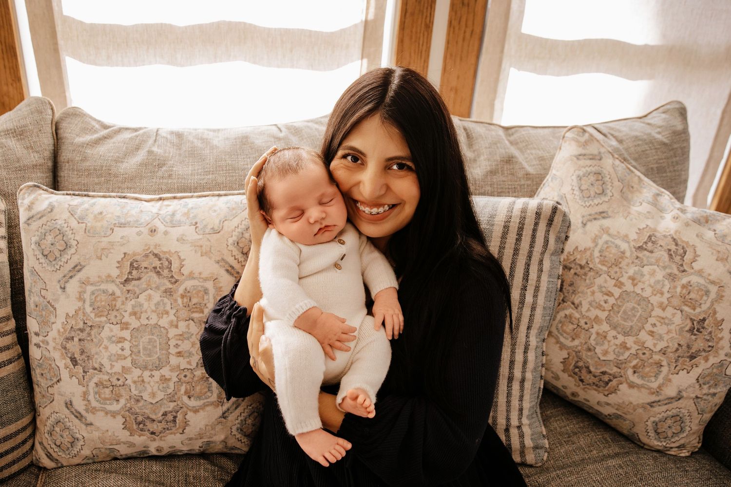 A collage of tender family moments showing a mother and baby sharing loving interactions on a couch with decorative pillows.