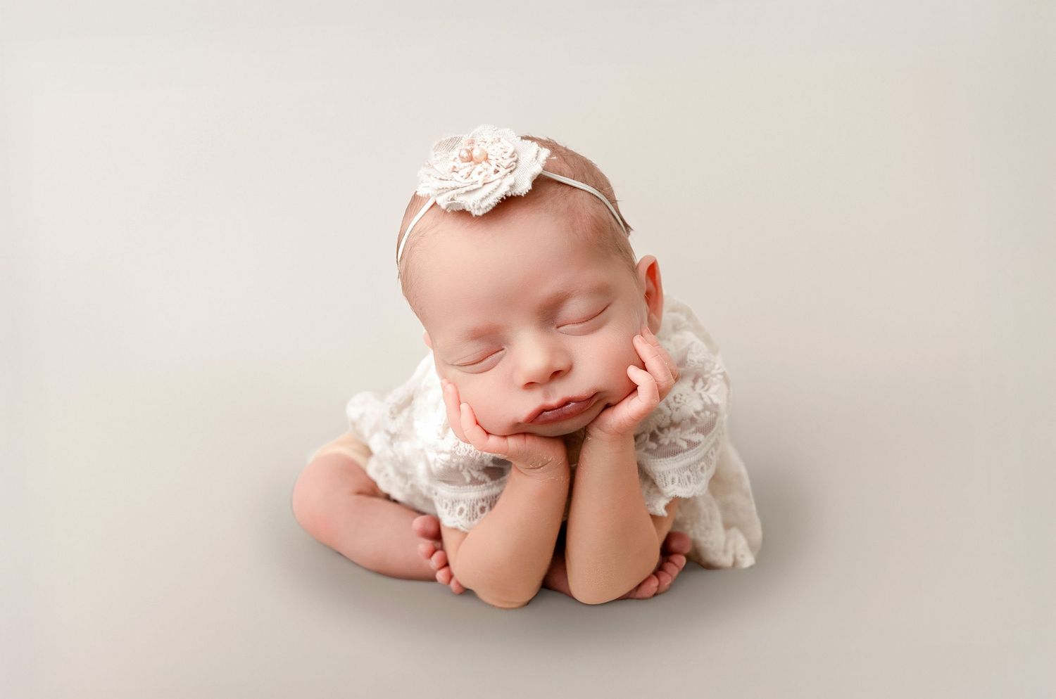 A series of soft, dreamy newborn photography portraits in muted tones showing a sleeping baby in delicate poses.