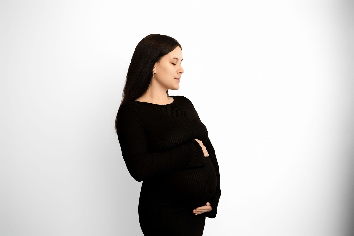 A person wearing a black turtleneck sweater poses against a white background in multiple side profile shots.