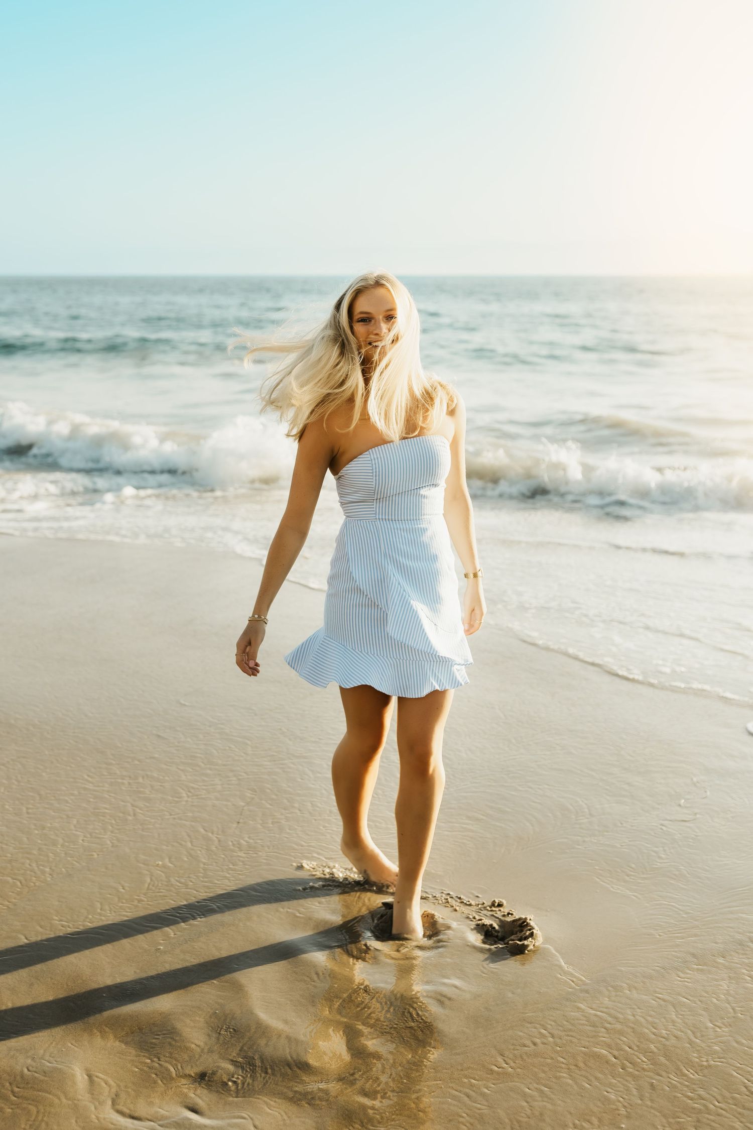 Senior portrait at the beach in Orange County celebrating graduation