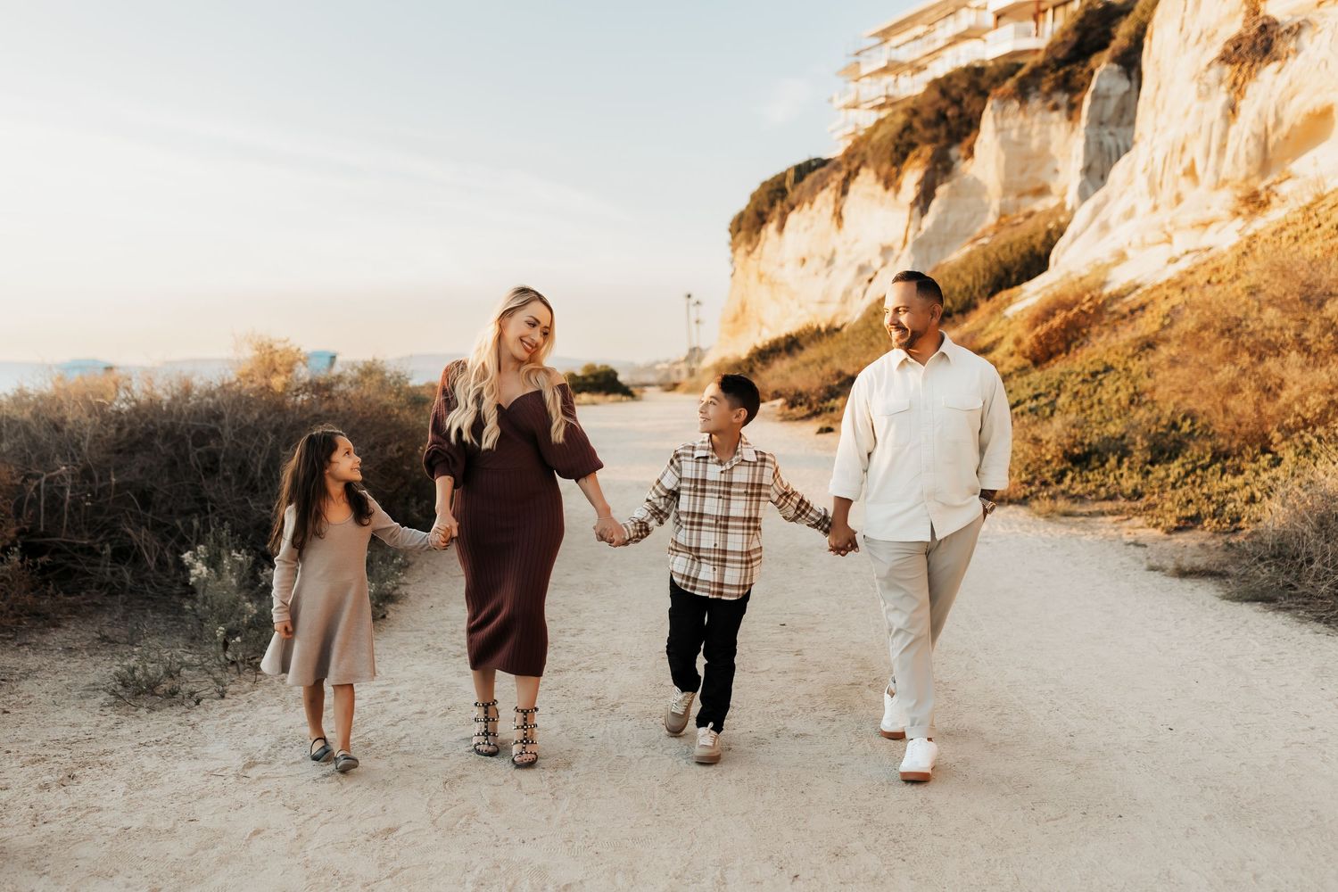 Beach family photos with coordinating neutral colored outfits