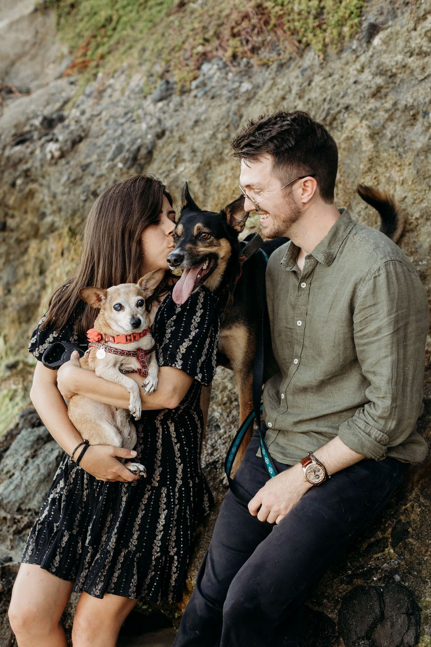 OC beach couples session interacting with their dogs