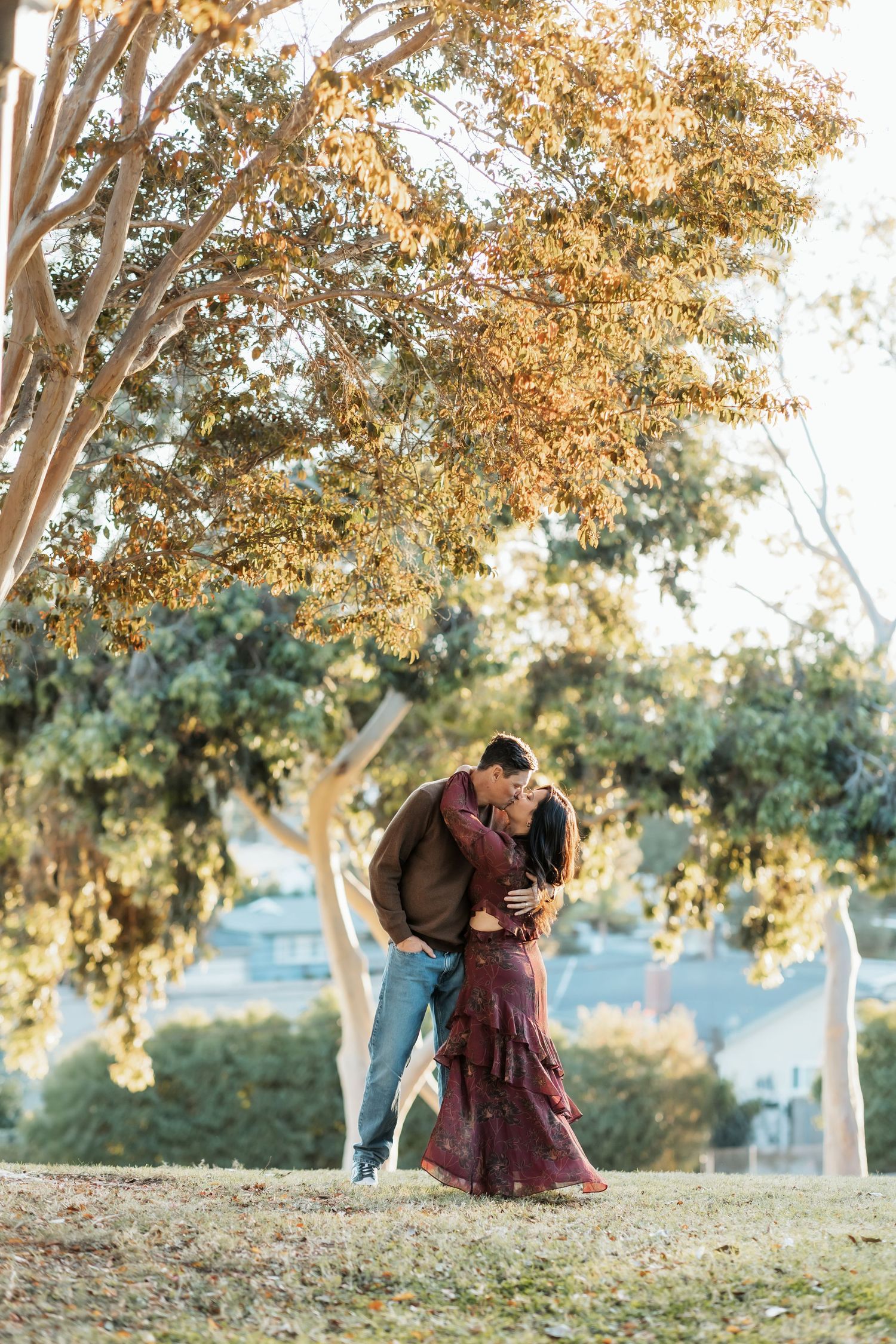 A couple with their arms around each other for a family photo session in Fullerton, CA