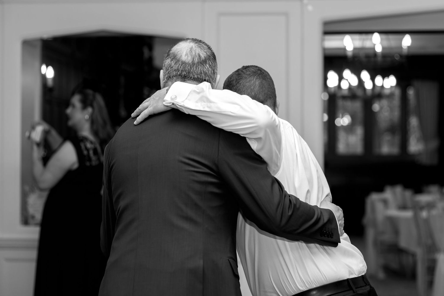 A black and white photo collage shows couples dancing together in formal attire at what appears to be a wedding reception.