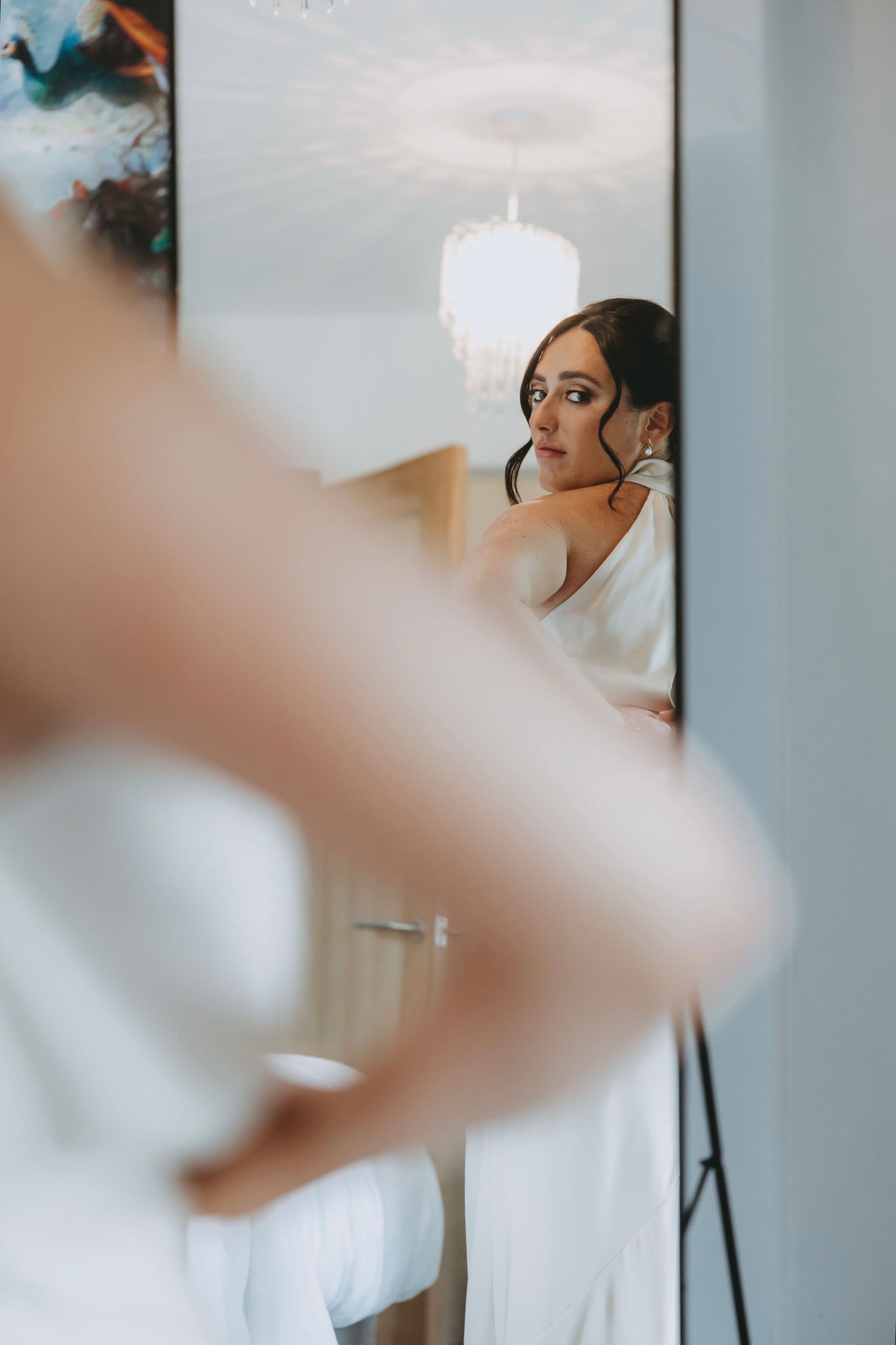 Getting ready moments captured in a series of soft, dreamy wedding preparation photos.