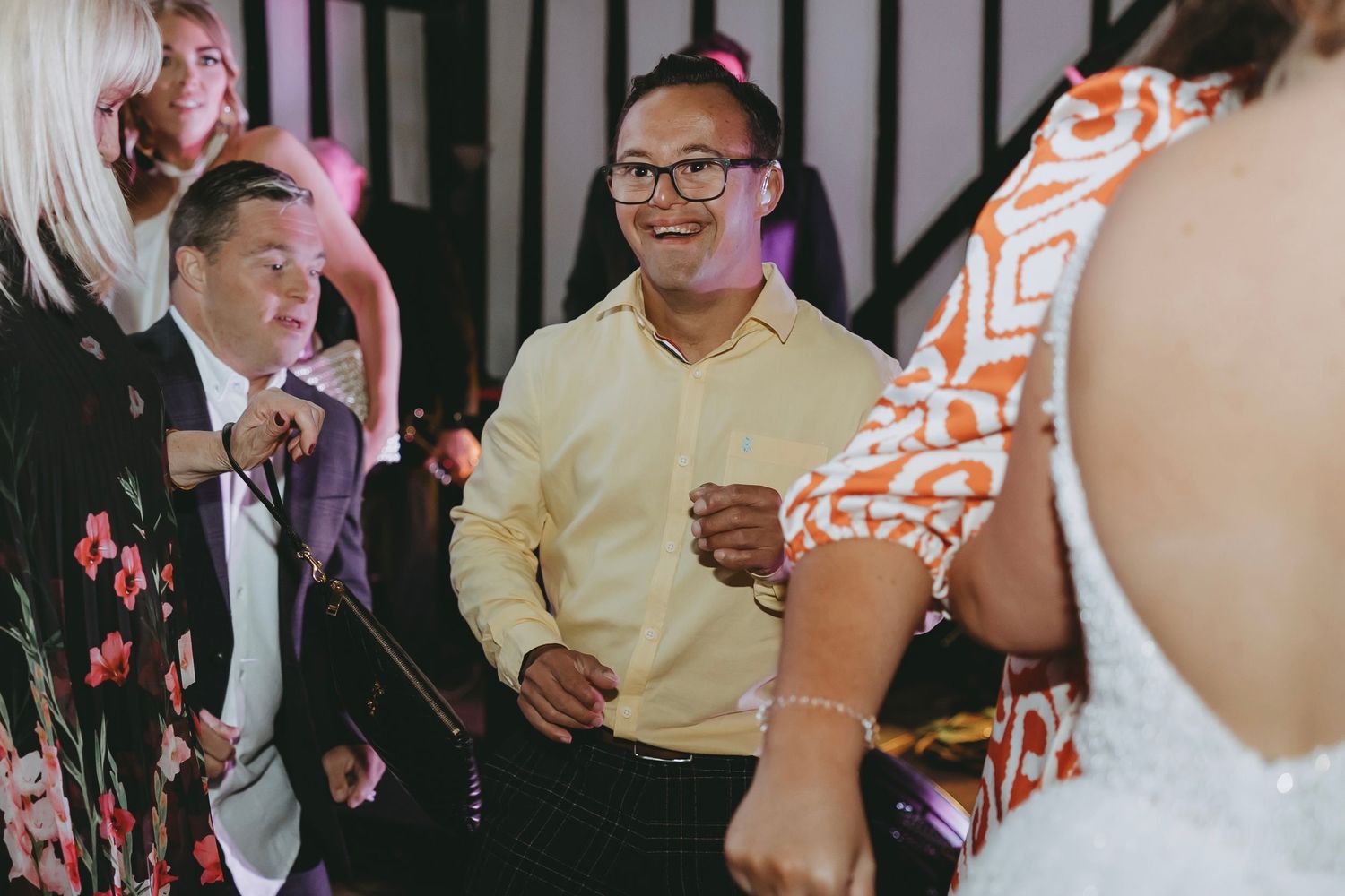 Wedding celebration showing guests in formal attire dancing and enjoying the reception.
