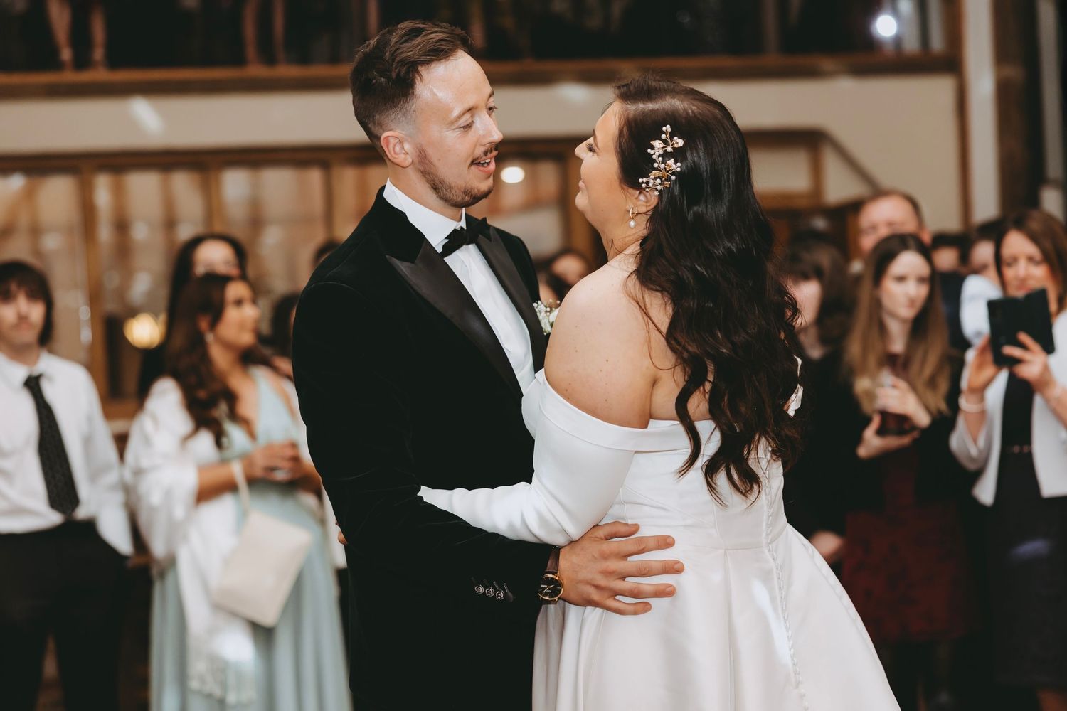 Elegant couple sharing a romantic dance moment at their wedding reception.