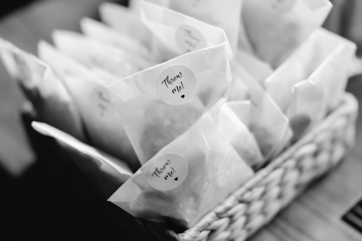 White wrapped packages arranged in woven basket storage.