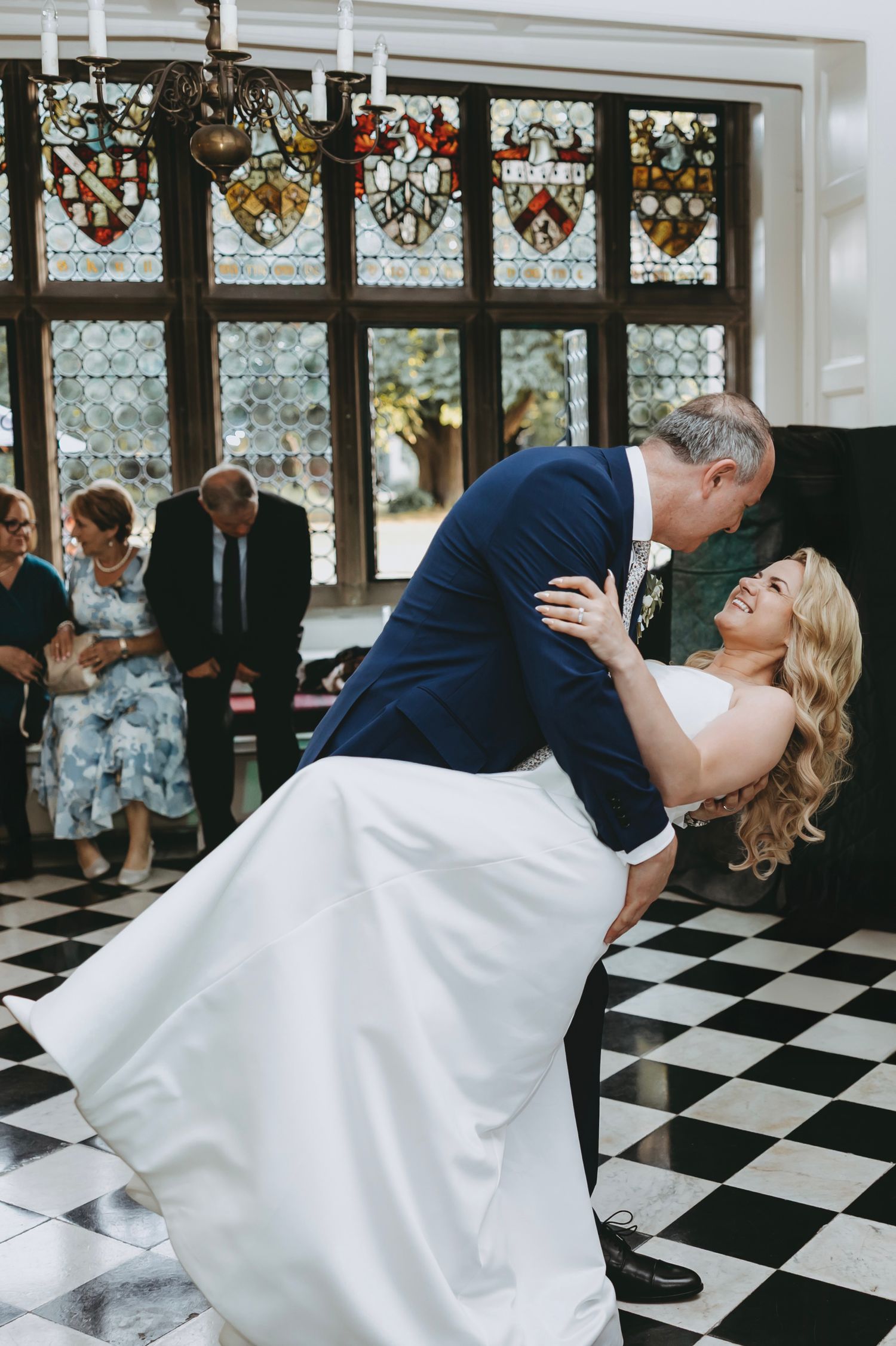 Elegant dance moves on a striking black and white checkered ballroom floor at Fanhams Hall, Ware, Hertfordshire.