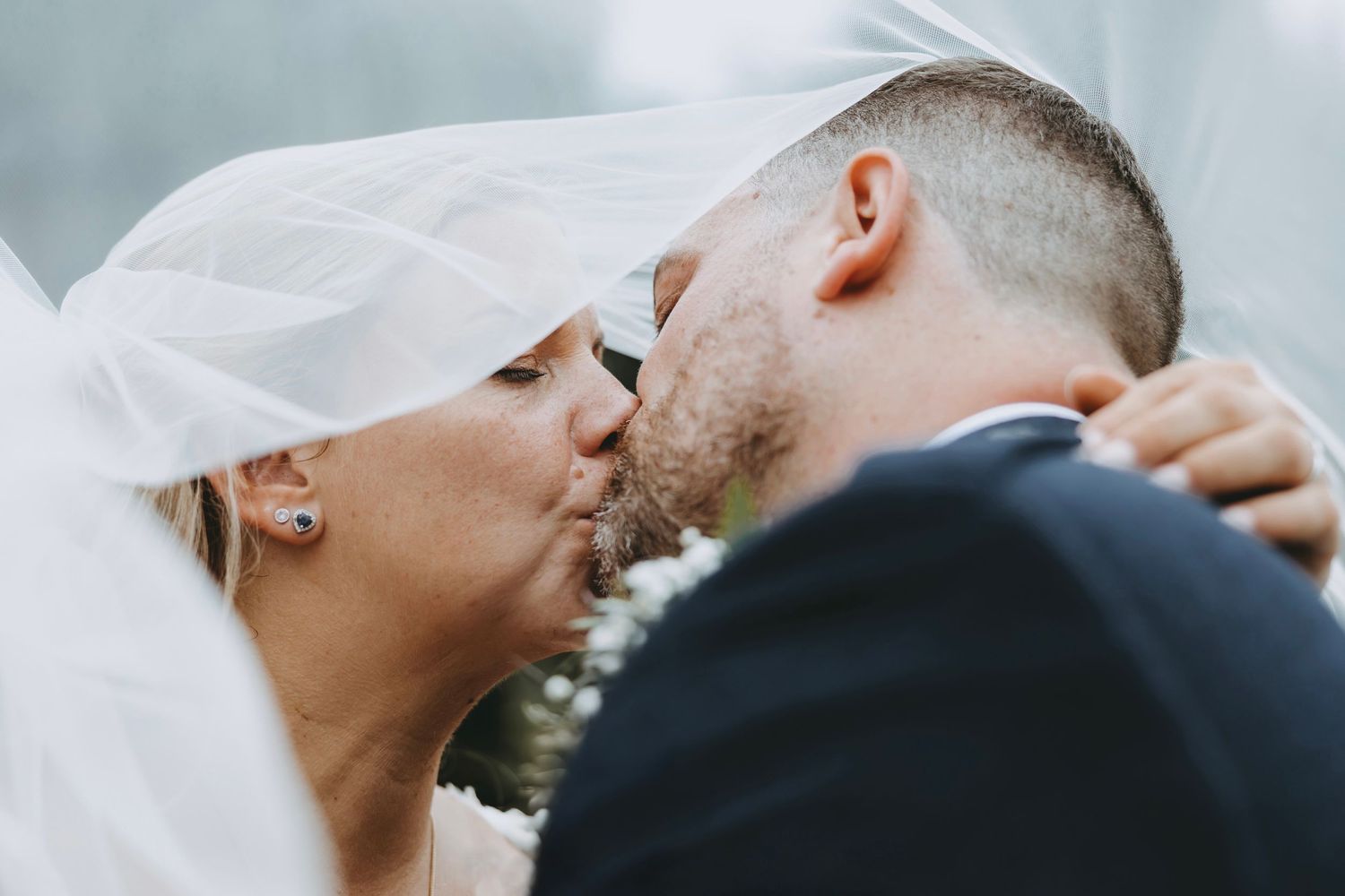 Soft focus romantic wedding portrait capturing an intimate moment.