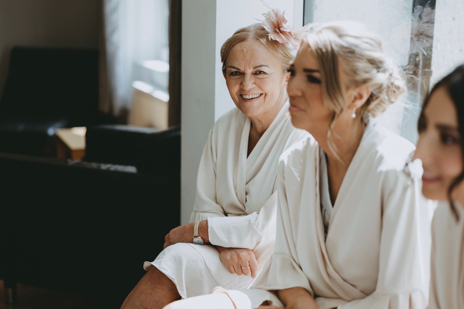 Candid moments captured during bridal party preparations.
