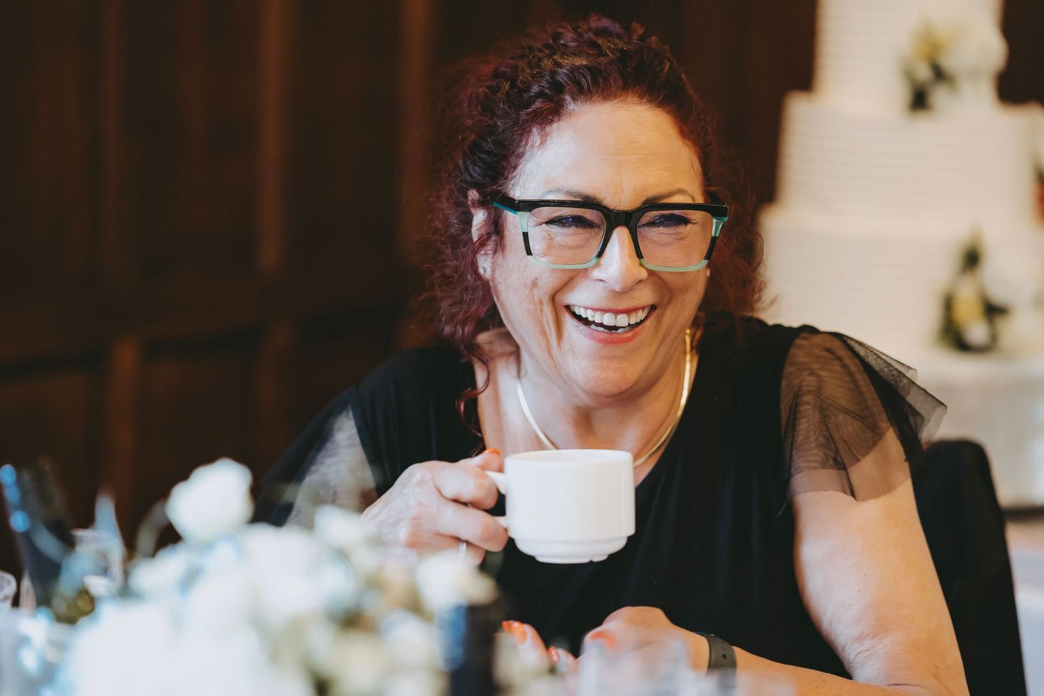 Candid moments captured during an indoor formal event.