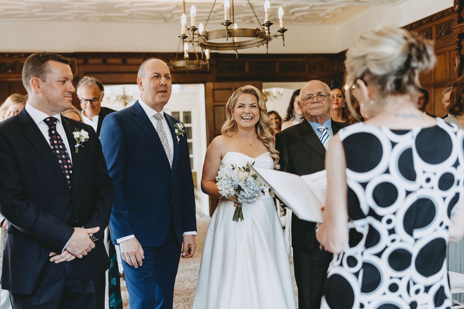 Wedding venue decorated with modern black and white polka dot accents and traditional elements.