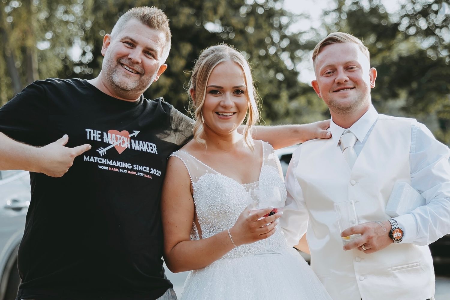 Candid moments captured during an outdoor wedding celebration with guests interacting.