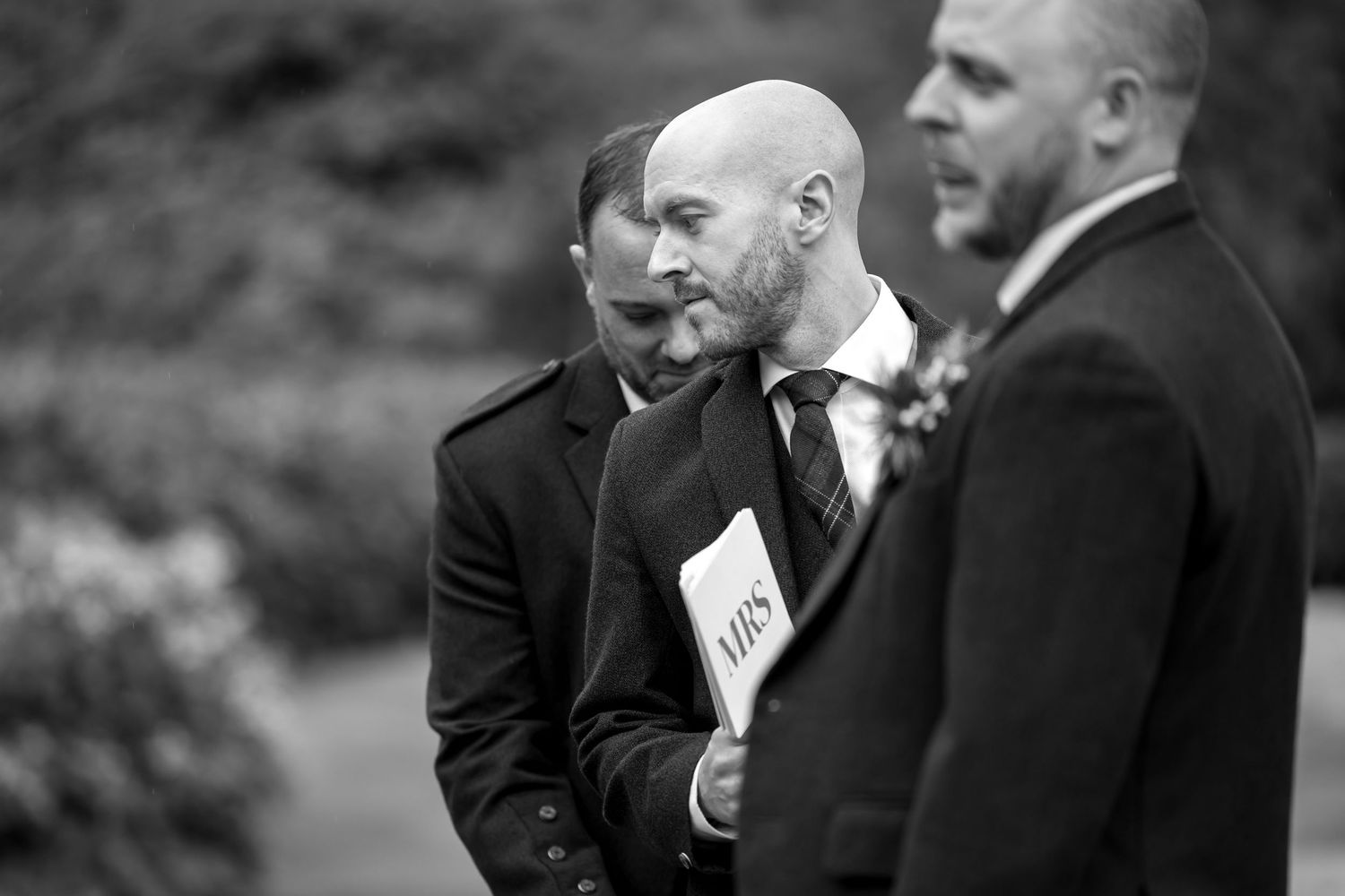 Black and white candid shots of guests at a formal gathering.