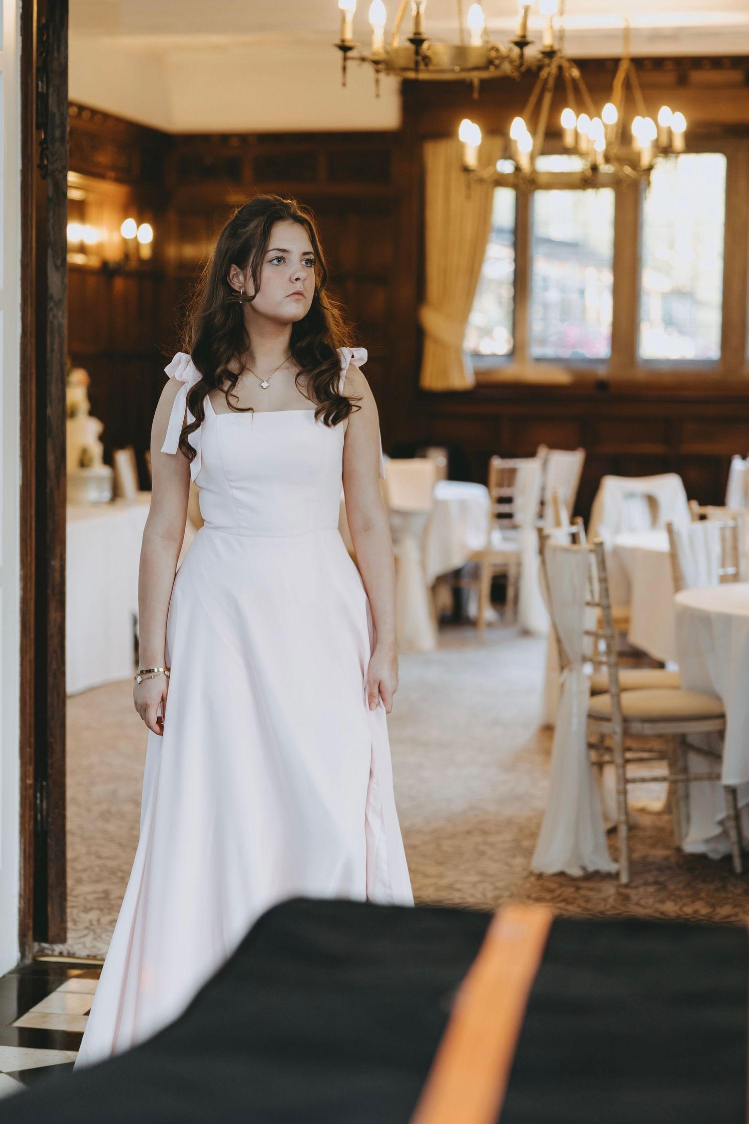 Fanhams Hall, Ware, Hertfordshire, Wedding venue interior with chandeliers and elegant white decor.