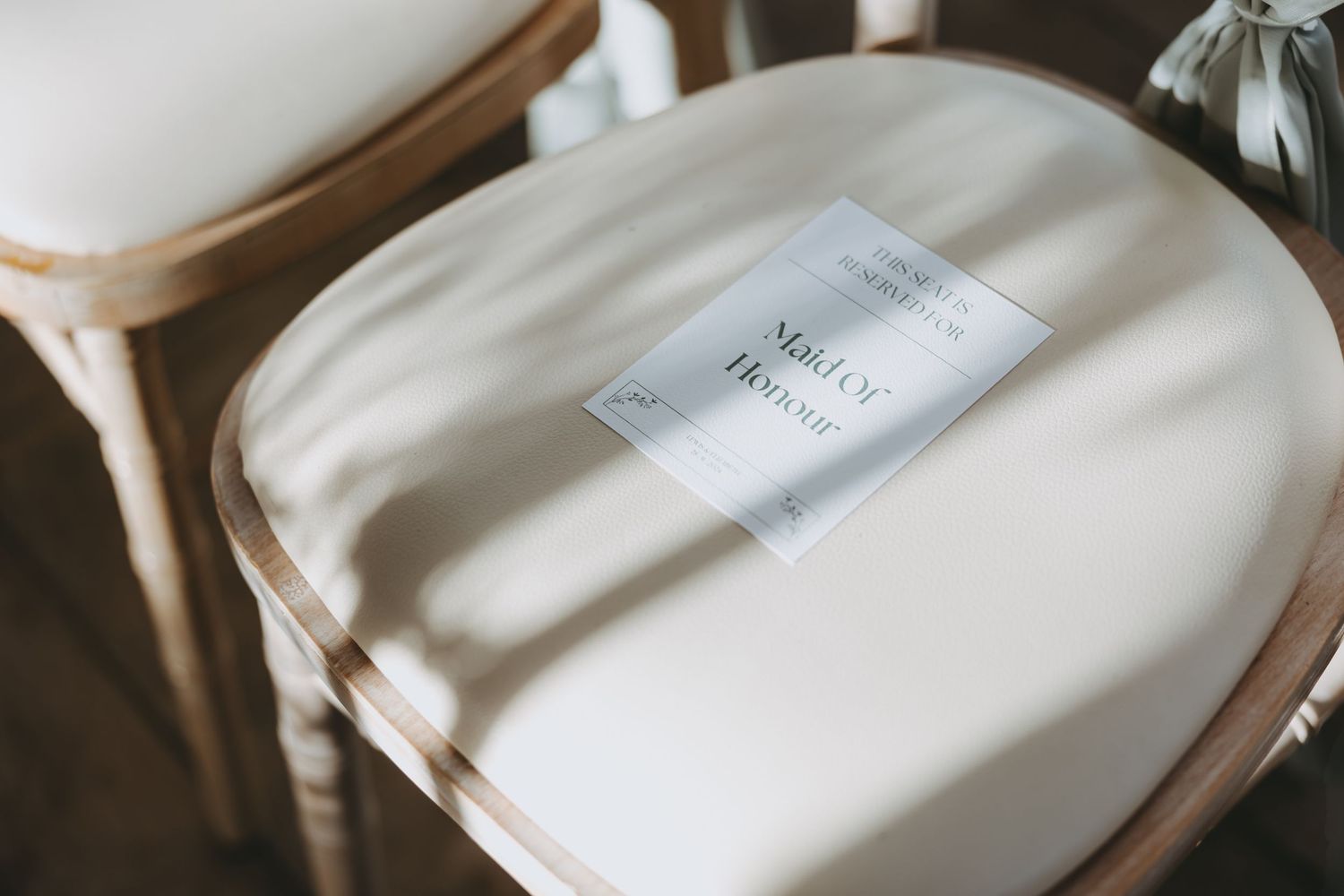 Soft focus detail shots of wedding dress labels and fabric textures.