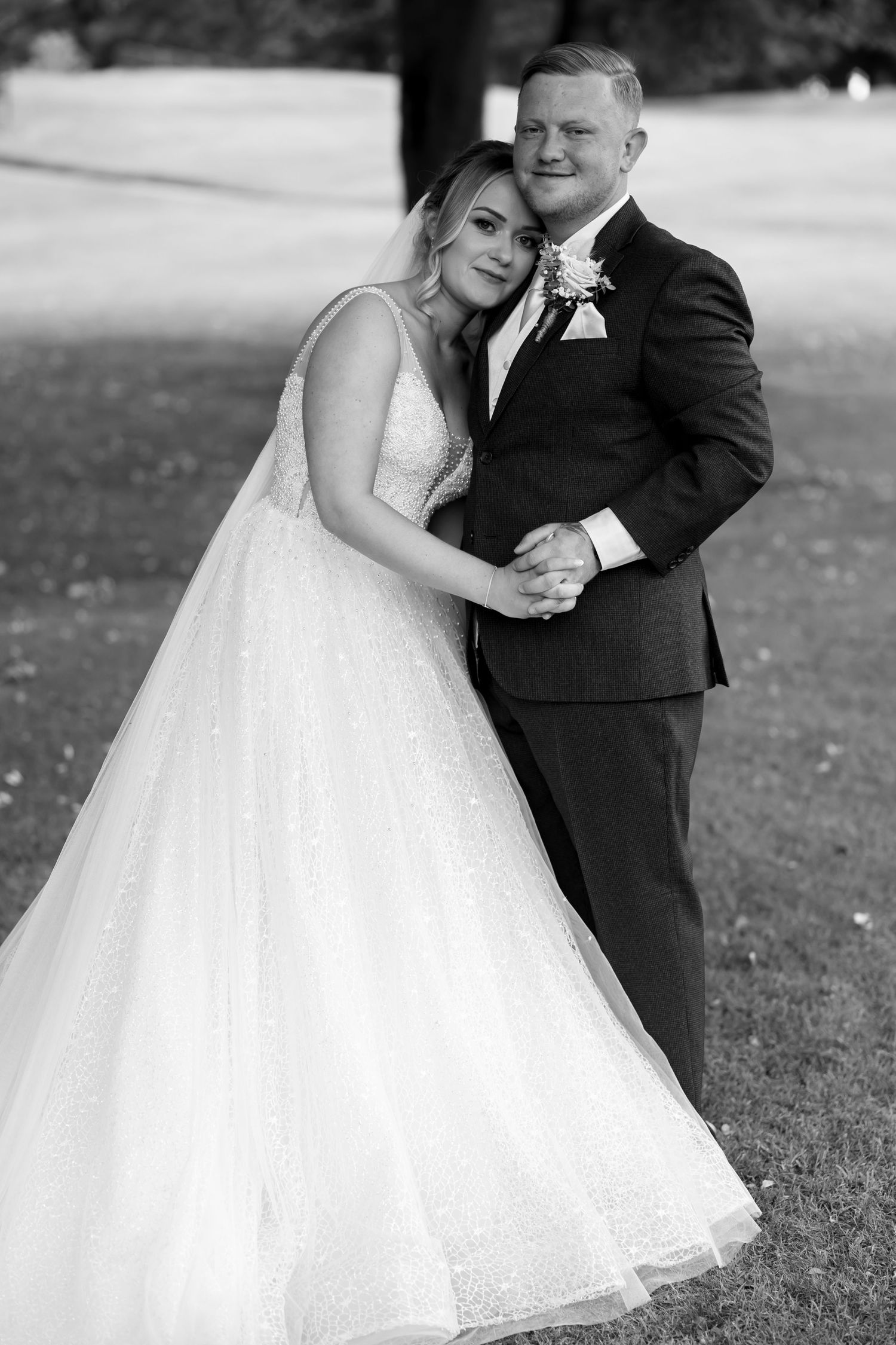 Close-up shots of a couple dancing together during their outdoor wedding celebration.