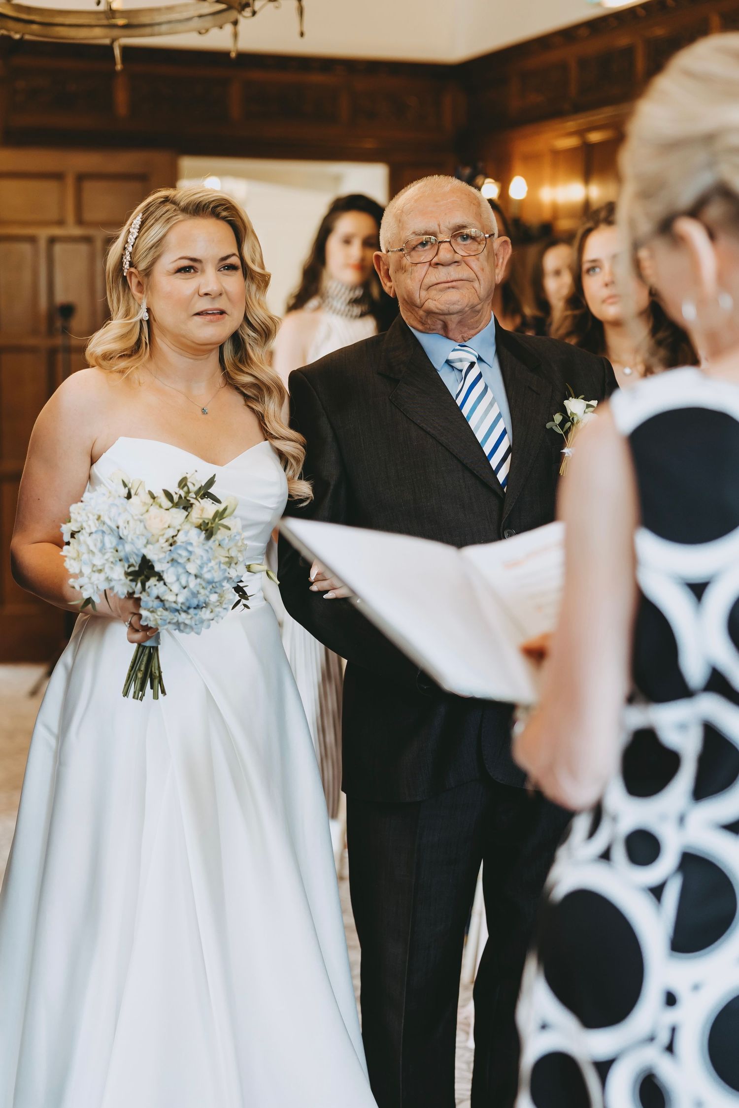 Wedding ceremony lineup with striking black and white polka dot decorative elements.
