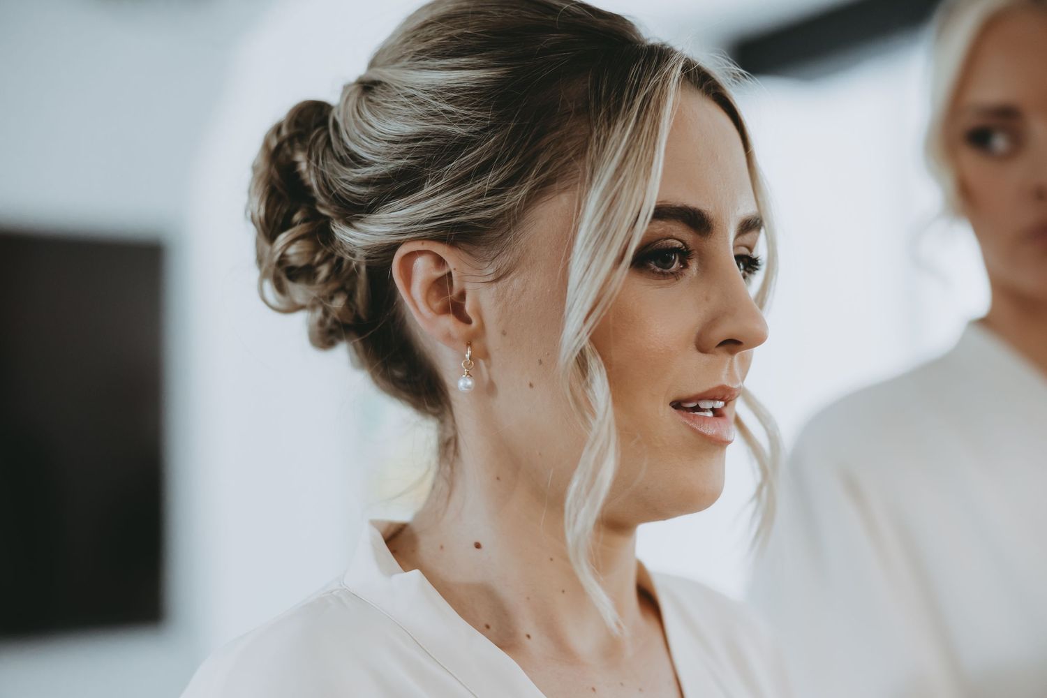Close-up shots of bridal party hair styling during wedding preparations.