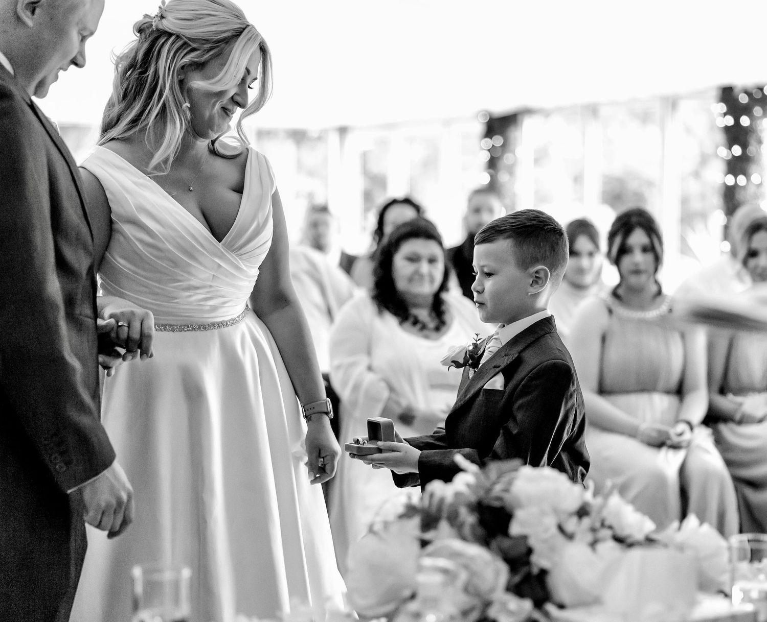 Wedding guests celebrating with champagne at an elegant reception.