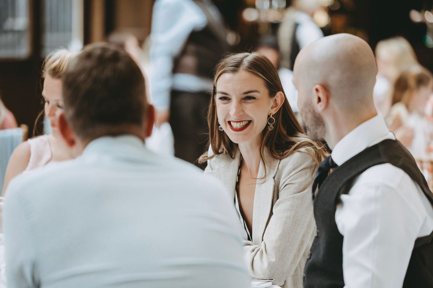 Candid moments captured during an elegant indoor celebration.