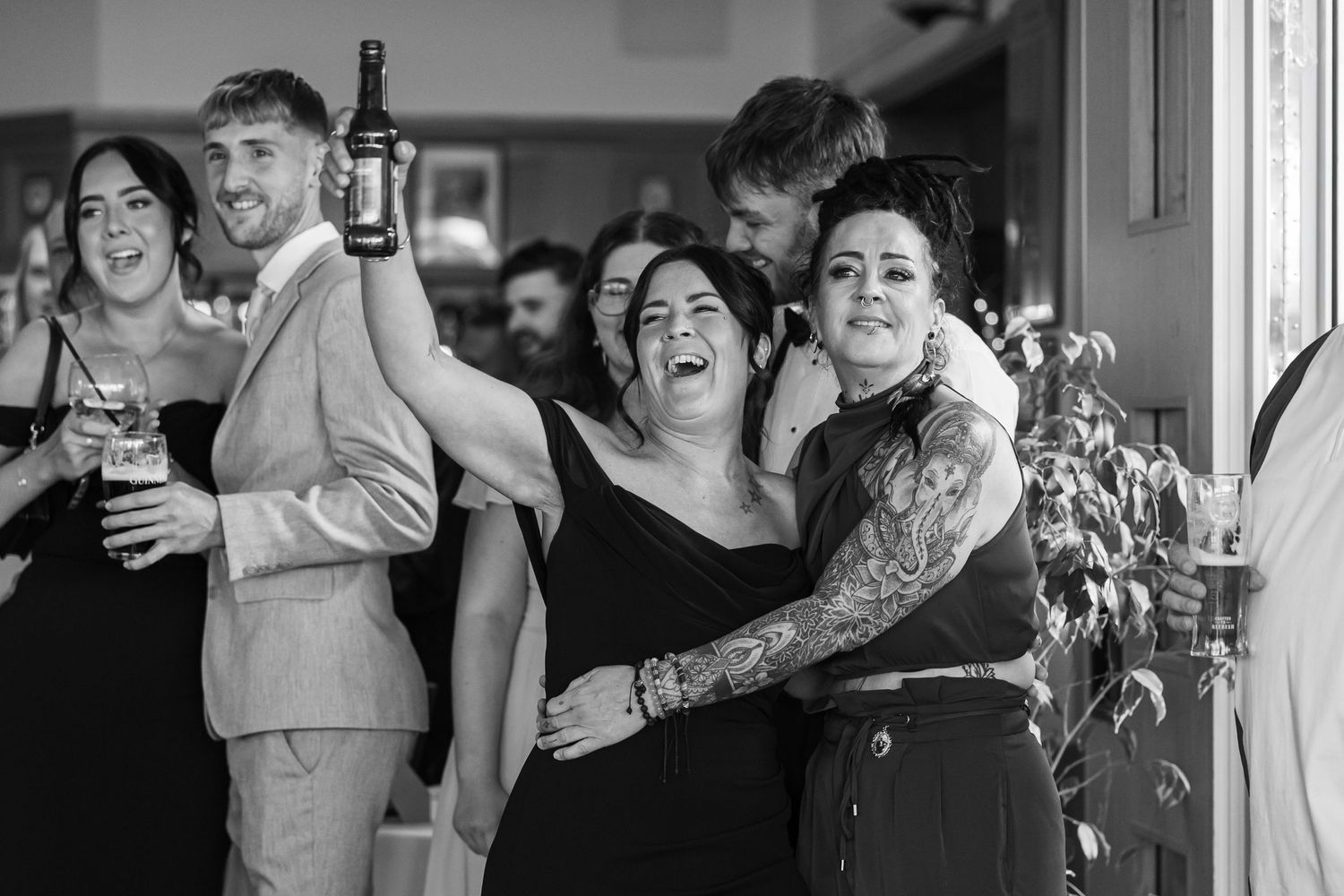 Wedding celebration candid moments captured indoors with natural lighting.