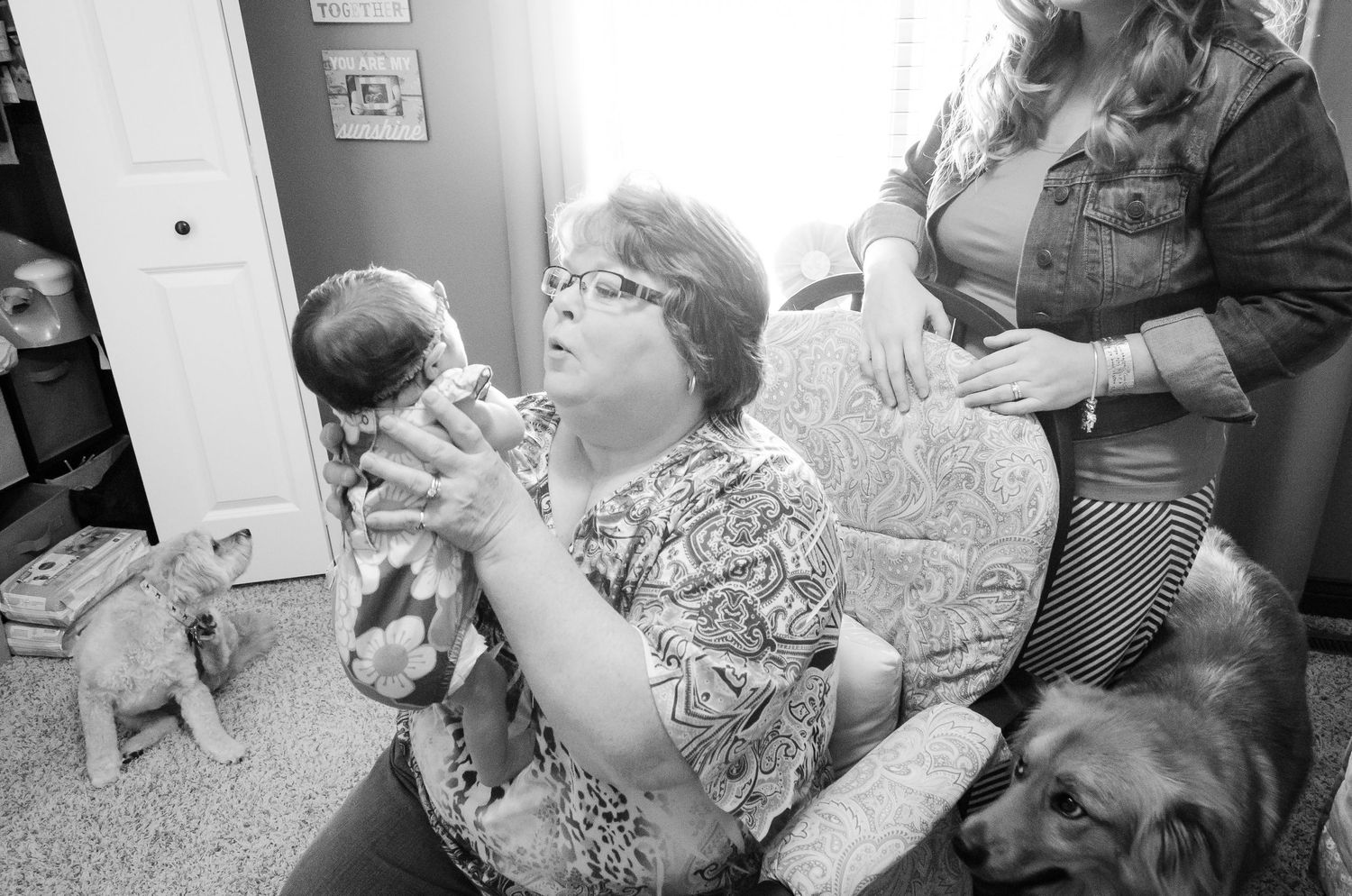Indoor lifestyle photography session showing candid family moments.