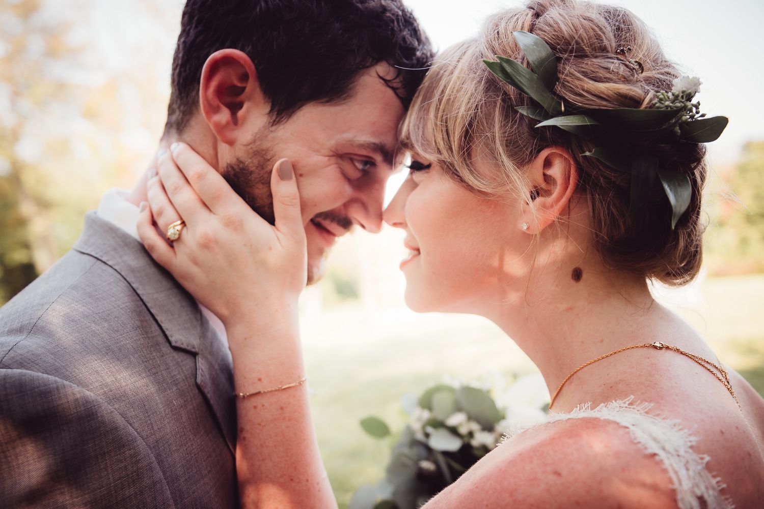 Romantic golden hour portraits of newlyweds sharing tender moments outdoors.