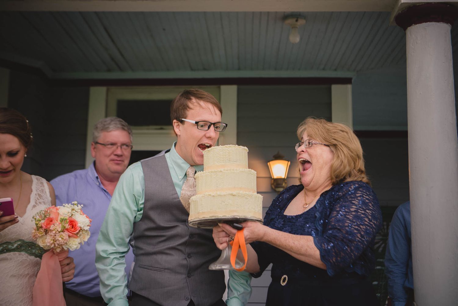 Casual outdoor gathering with guests sharing laughs on a porch.