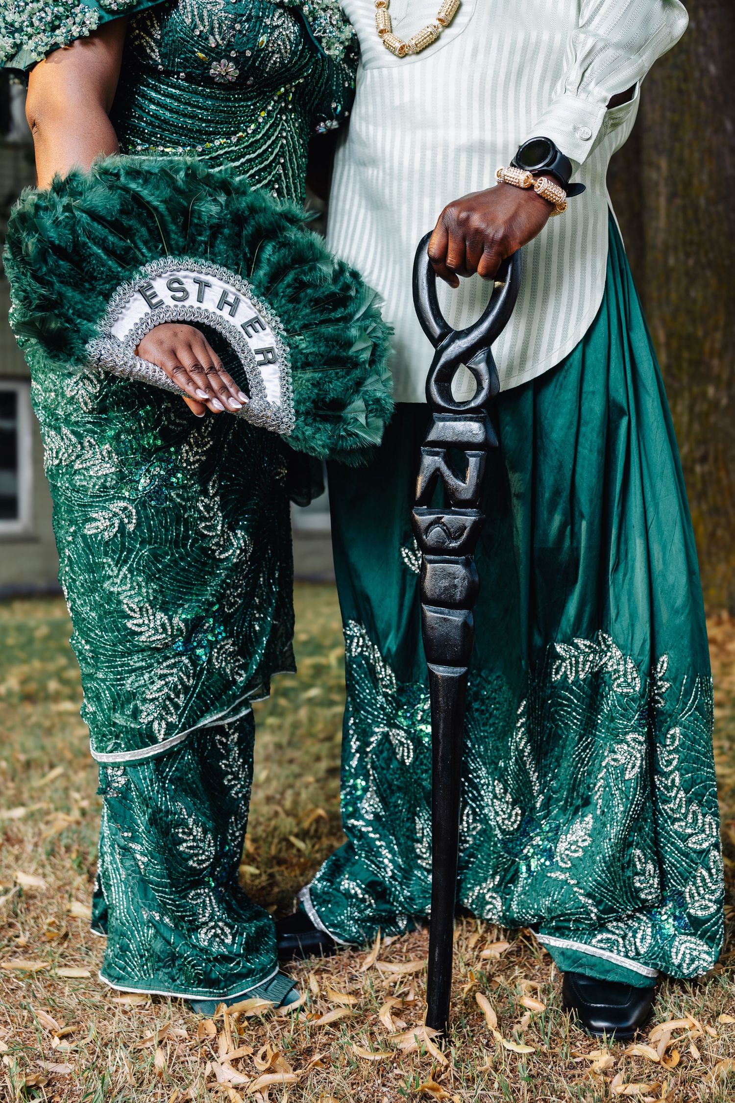 couple posing for their traditional wedding photoshoot outside in Winnipeg with traditional african attire