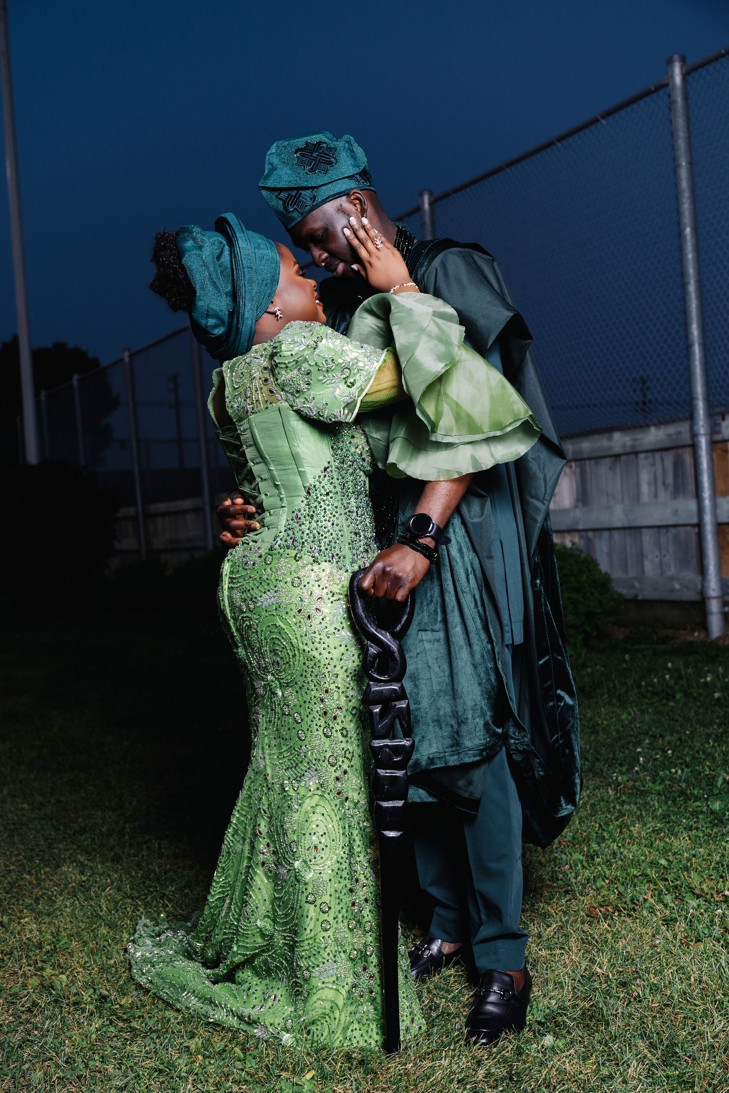 couple posing for their traditional wedding photoshoot outside in Winnipeg with traditional african attire.