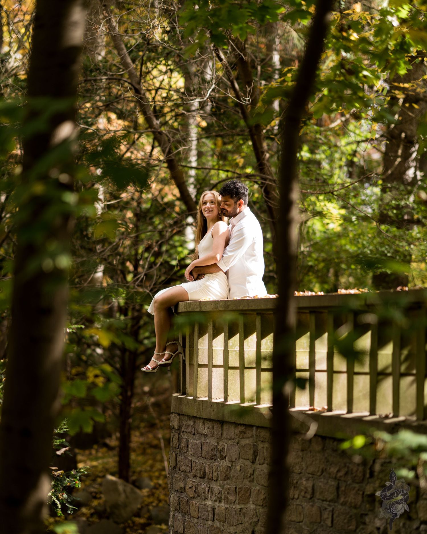 A couple hugging lovingly during an engagement session by Porsche Aremia