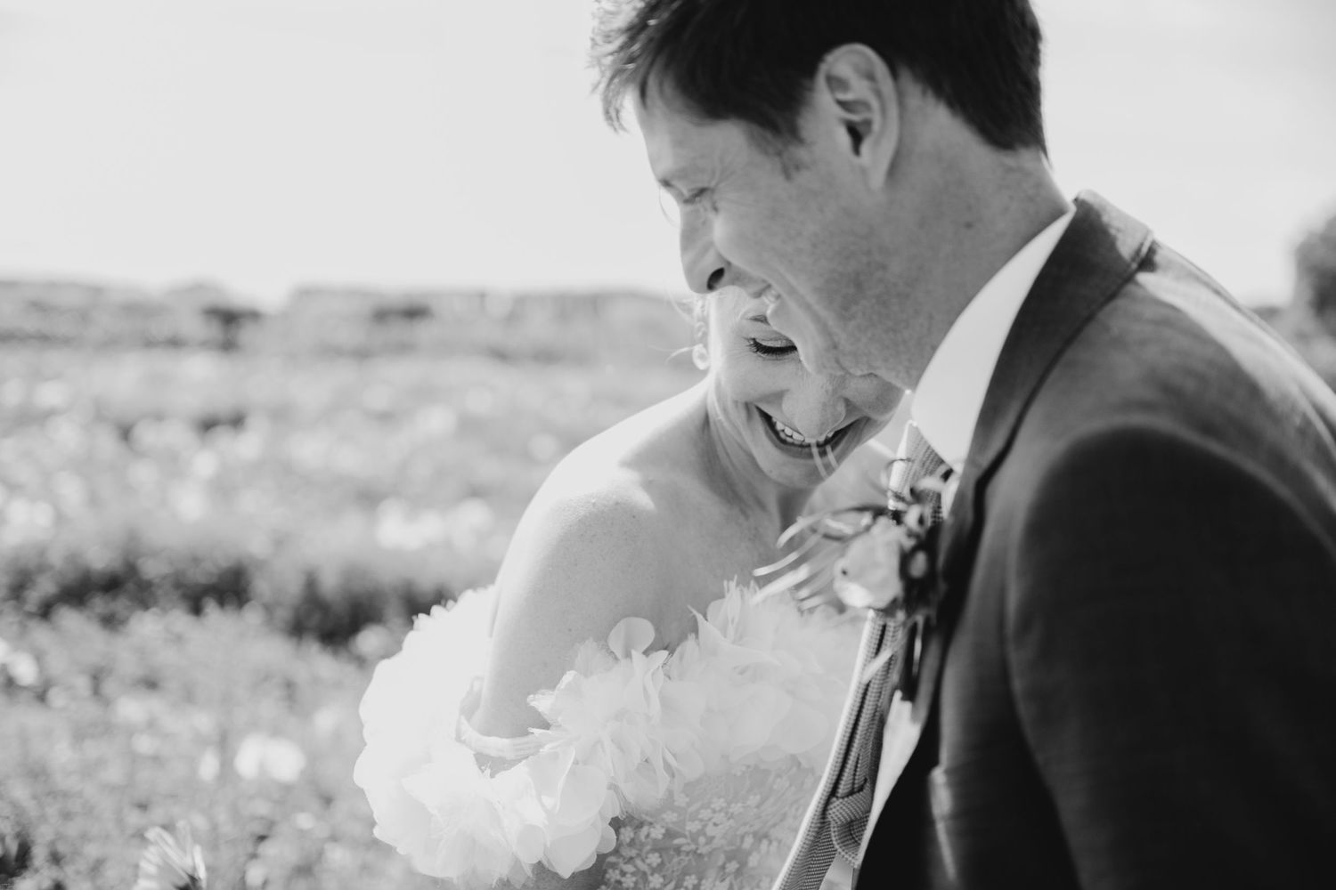 Intimate moment shared between couple in natural outdoor setting.