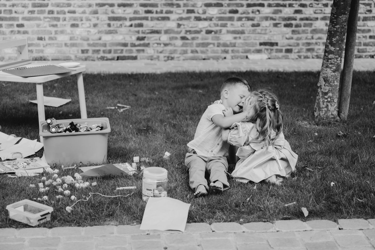 Scattered wedding decorations and personal items laid out on grass in preparation for an event.