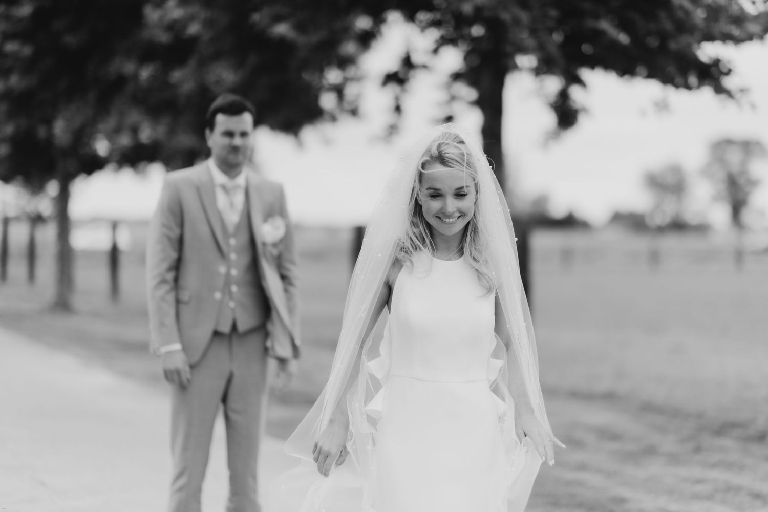 Elegant outdoor wedding ceremony captured in classic black and white photography.