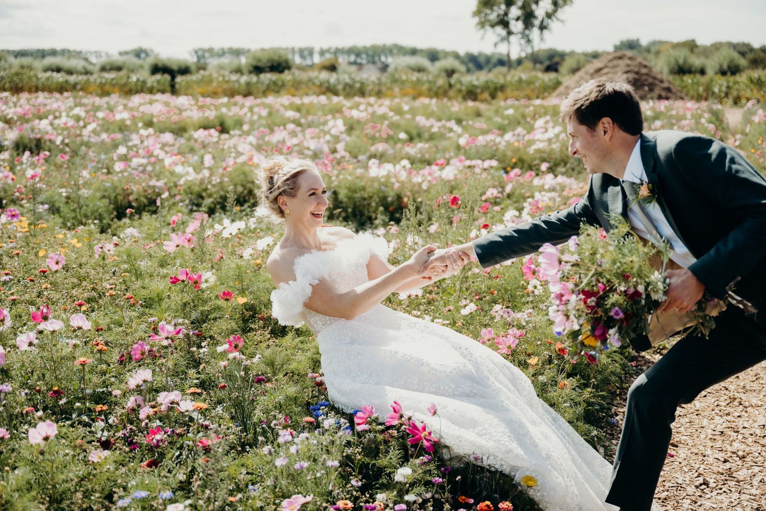 Romantic moment captured in a blooming flower field during sunset.