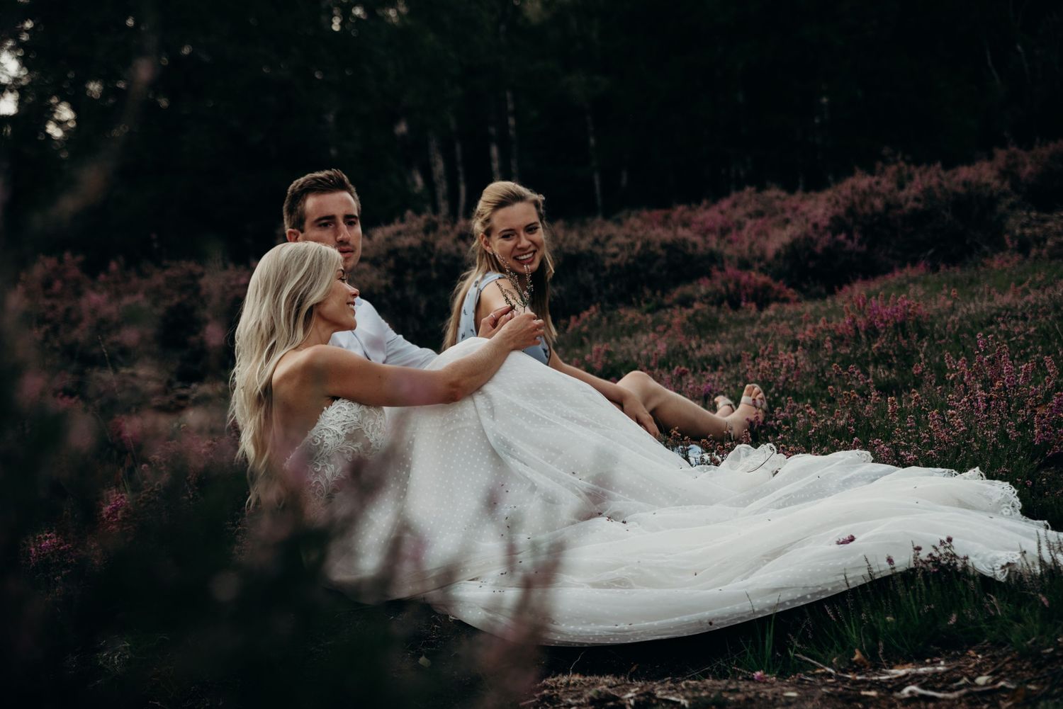 Flowing white wedding dress captured in motion against a natural outdoor backdrop.