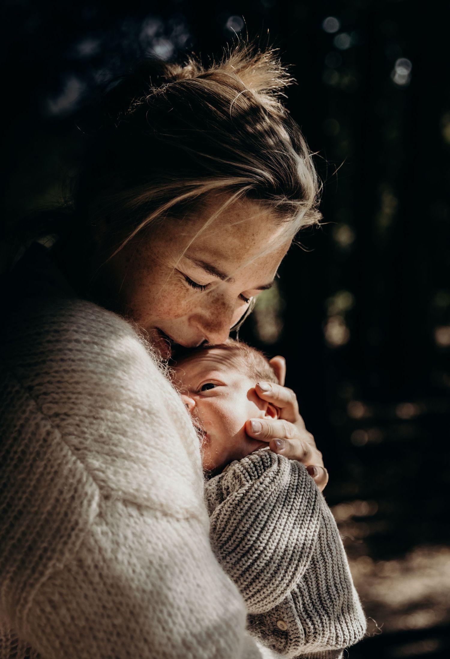Person wearing cozy knit sweater in intimate winter portrait.
