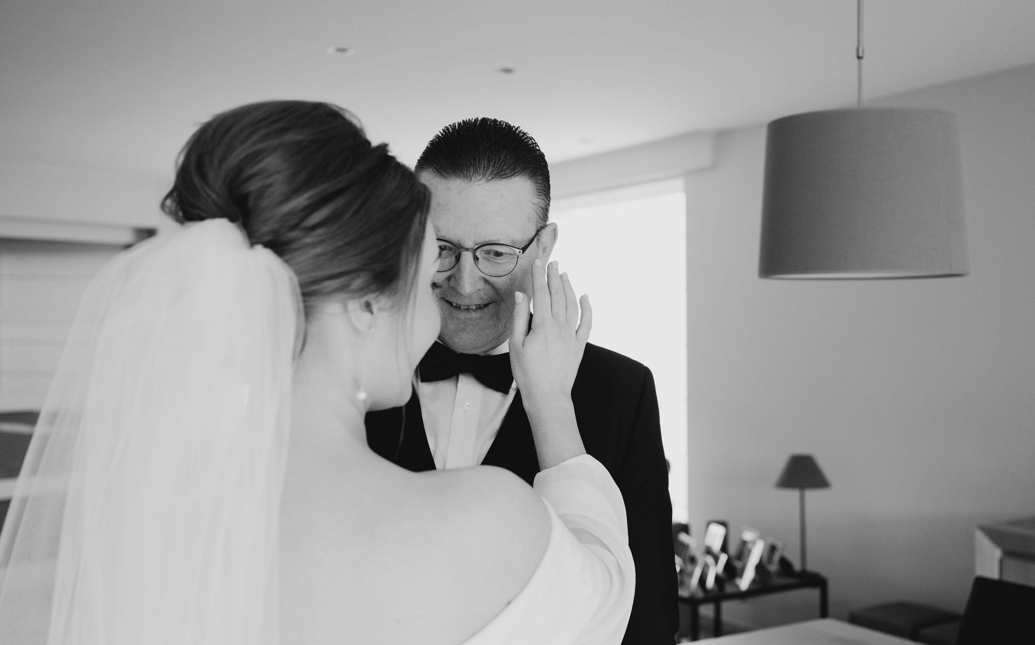 Intimate black and white wedding moments captured indoors.