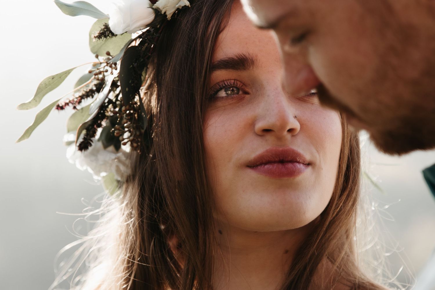 Close-up shots capture ethereal bridal portraits with floral crown details and soft lighting.