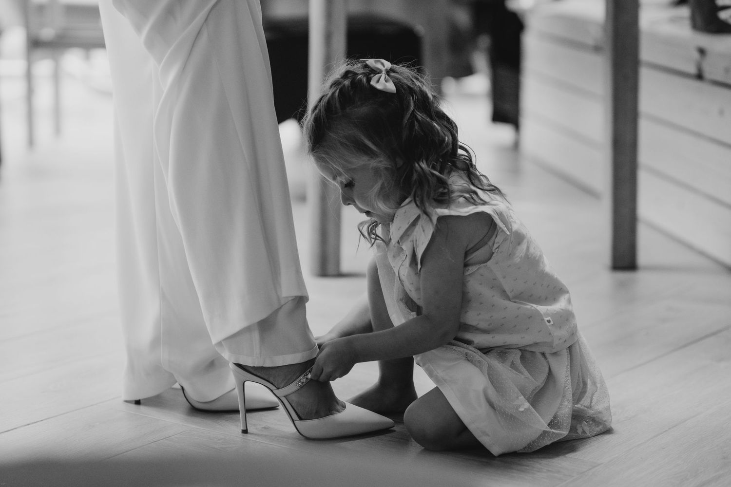 Elegant wedding preparation moments captured in a bright indoor setting.