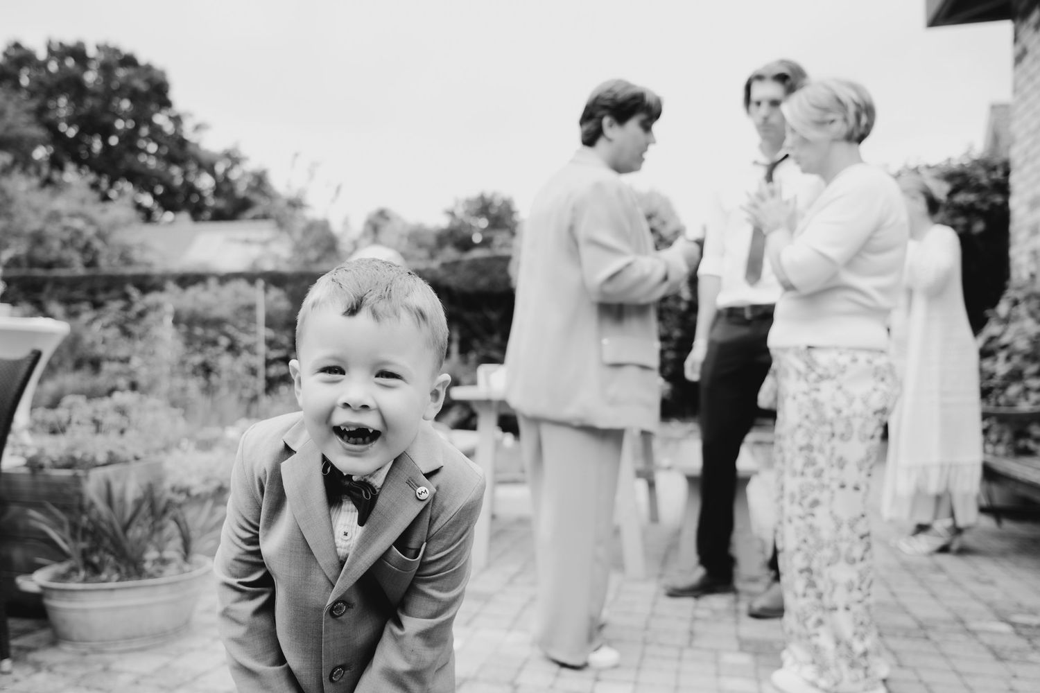 Vintage-style black and white outdoor wedding photography sequence.