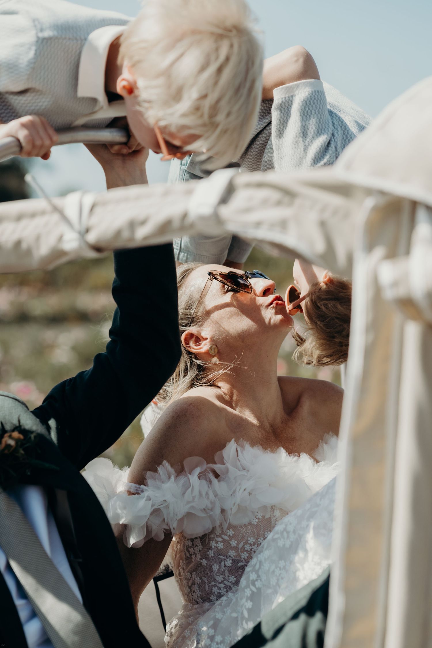Couple shares a playful moment during their outdoor wedding ceremony.